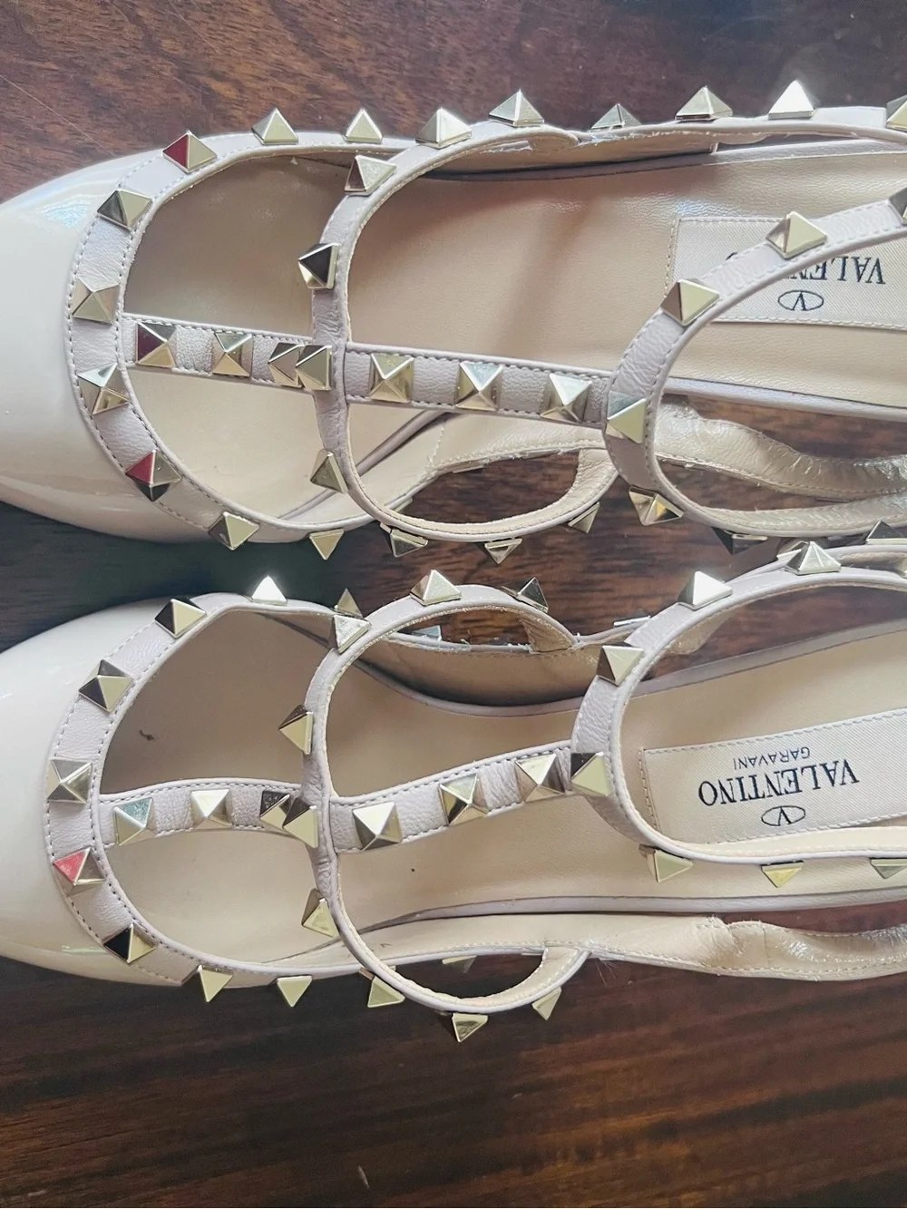 Valentino Garavani patent nappa leather pump feature iconic platinum-finish stud